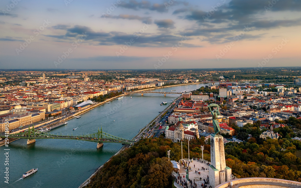 Budapest cityscapes form Gellert Hill. Amazing sunset in the background. Included the Danube river, historical bridges, Budapest dwontown,  Liberty bridge