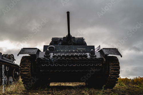 The tank is facing the camera cloudy sky background. Military concept. Low angle