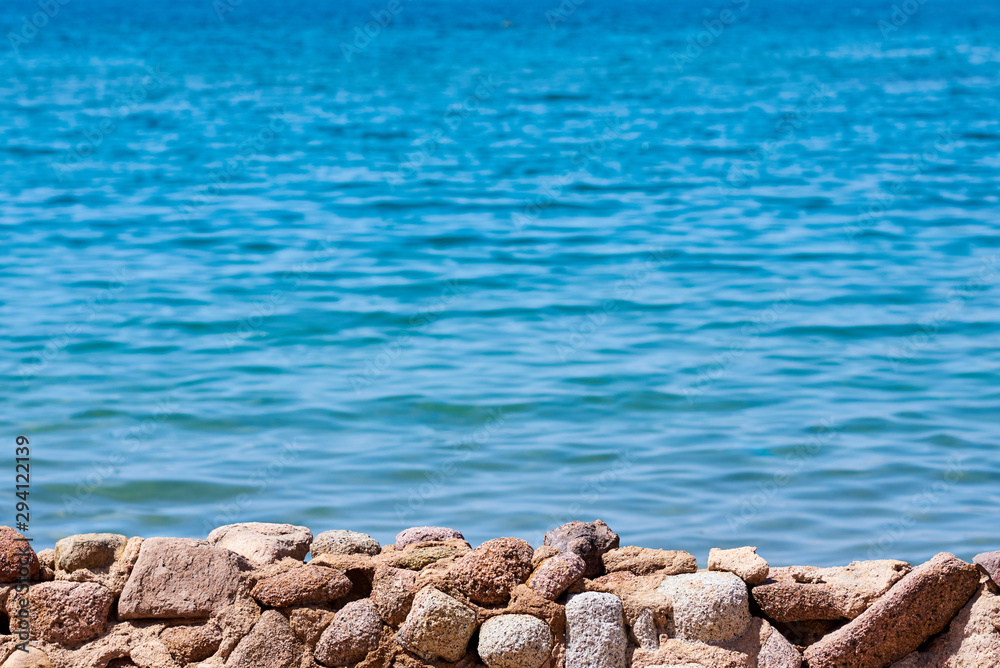Beautiful view of sea cost against blue sky Beautiful view of sea cost against blue sky