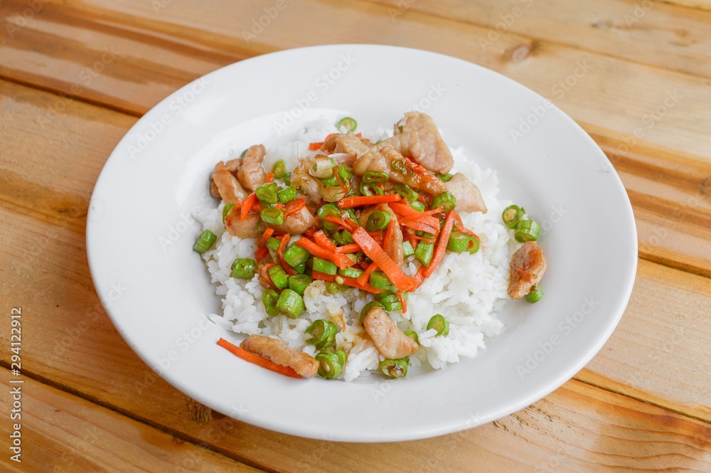 pork and vegetable fried on hot rice - Thailand healthy food