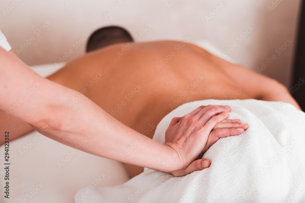 Man enjoying sports massage at spa