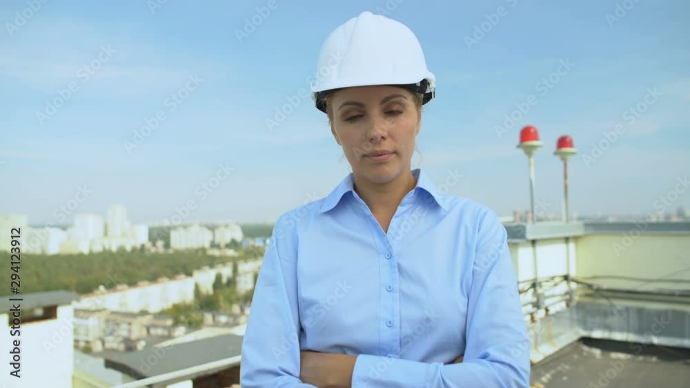 Experienced construction designer looking camera, professional engineer, service Experienced construction designer looking camera, professional engineer, service