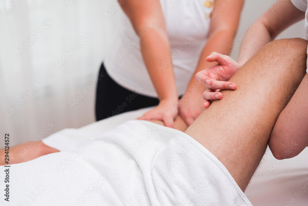Man enjoying sports massage at spa Man enjoying sports massage at spa