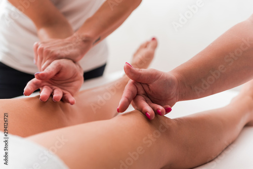 Woman having royal legs massage in Spa Salon
