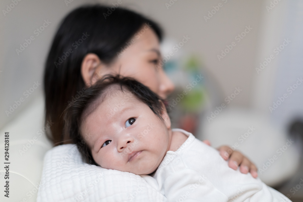 portrait of asian mother and baby relaxing portrait of asian mother and baby relaxing