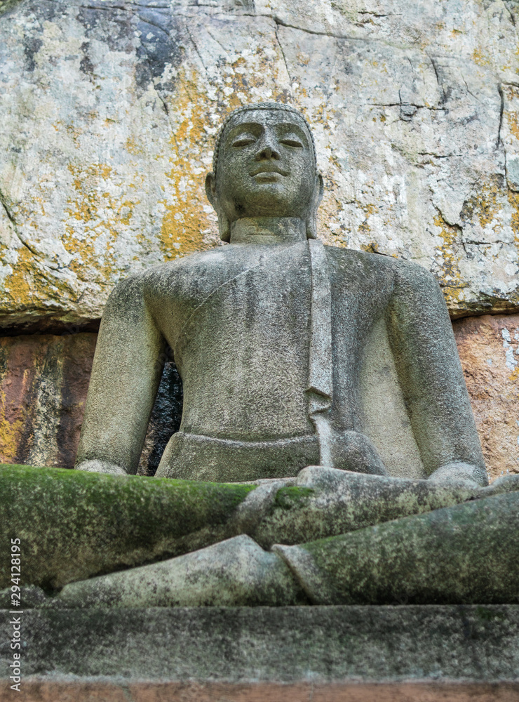 Buddha statue sitting in the lotus position, made of concrete. Buddha statue sitting in the lotus position, made of concrete.