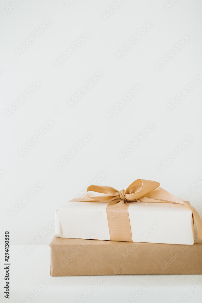 Christmas / New Year handmade craft gift boxes with bows. Winter holidays gifts packaging concept. Christmas / New Year handmade craft gift boxes with bows. Winter holidays gifts packaging concept.