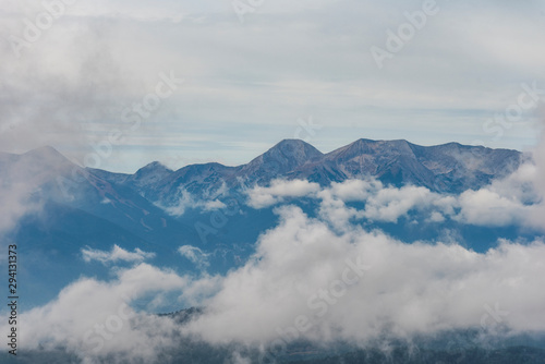 Foggy autumn landscape with Pirin mountain in background. Scene from Bulgaria