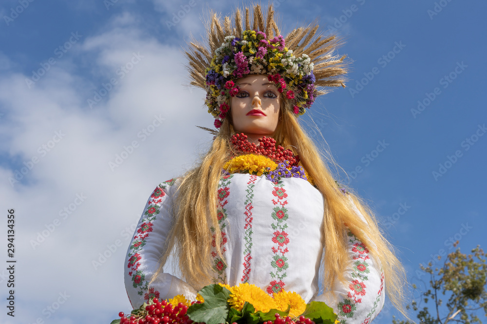 Beautiful doll dressed in Ukrainian outfit during a festival in Ukraine. Close up