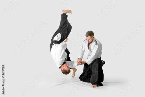 Two caucasian men are practicing aikido with waakizashi (isolation path included)