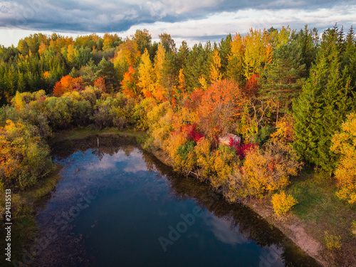 Aerial autumn landscape with lake and trees