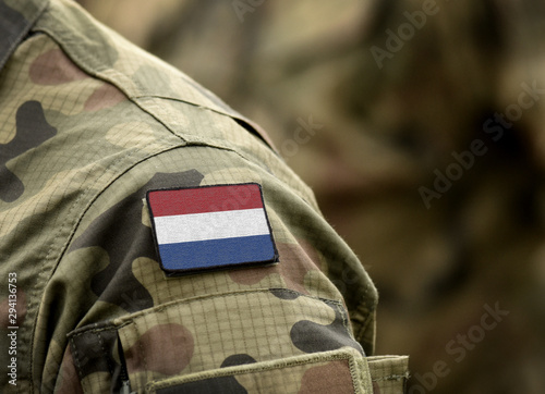 Flag of Netherlands on military uniform (collage). photo