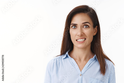 Картината върху платно Embarrassed uncomfortable cute adult woman feeling pity guilty making mistake, c