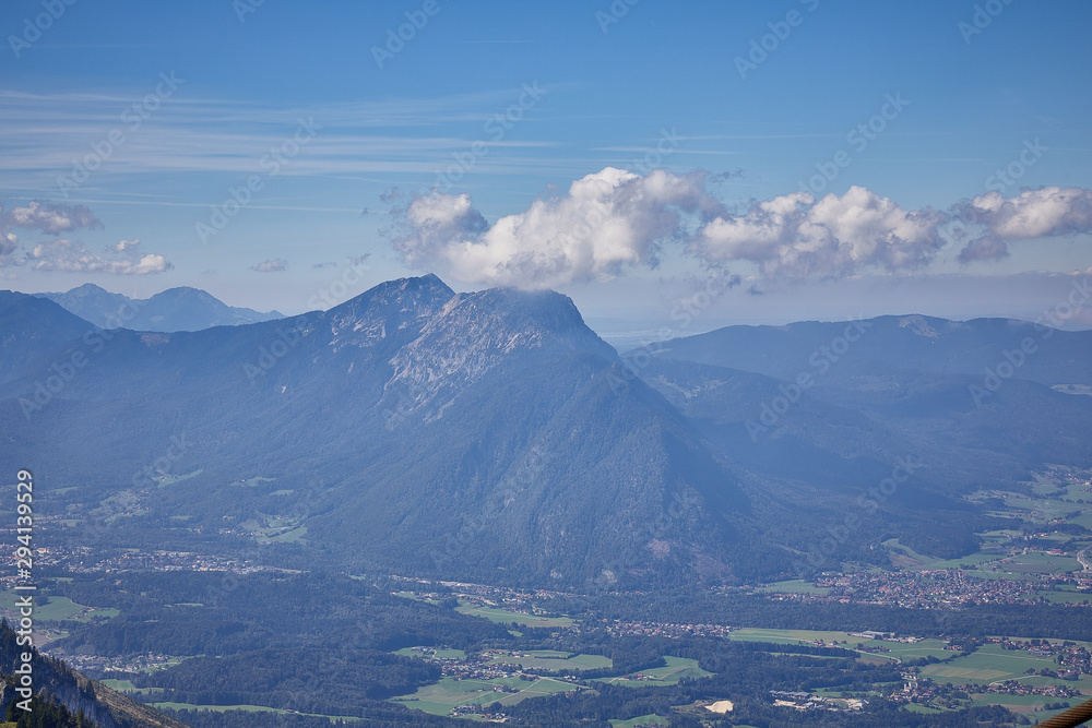 Mountain landscape in Austria, cloudy, forests, rocks, city in the mountains, summer Mountain landscape in Austria, cloudy, forests, rocks, city in the mountains, summer