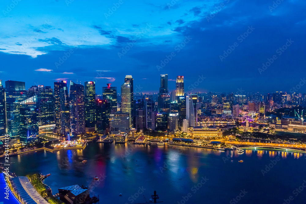 SINGAPORE, DECEMBER 20 2017 : Singapore financial district skyline, view of Singapore Skylines, Downtown and Financial District buildings in Singapore city at twilight from Marina bay sand.