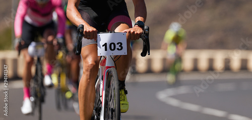 Fototapeta Naklejka Na Ścianę i Meble -  Cycling competition,cyclist athletes riding a race,climbing up a hill on a bicycle