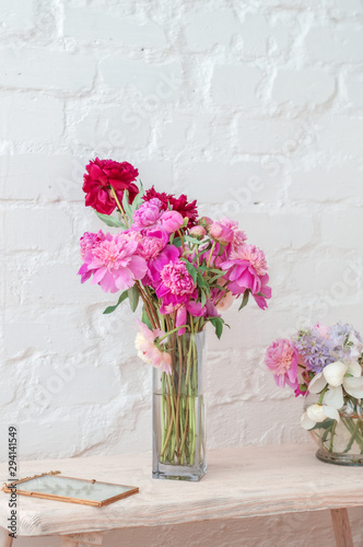 Fototapeta Naklejka Na Ścianę i Meble -  Flowers in vase over white wall