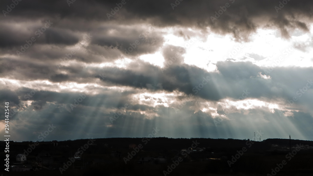 Sun beam in Dark Clouds and Sky before Thunderstorm Sun beam in Dark Clouds and Sky before Thunderstorm
