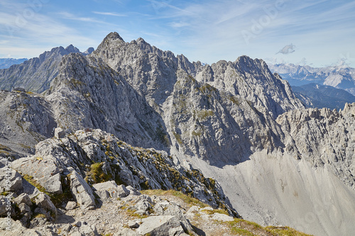 sharp cliffs in in the alps on a sunny 