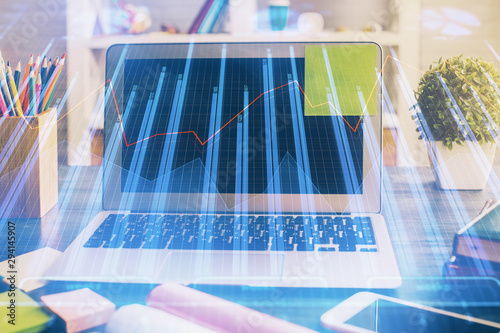 Multi exposure of graph and financial info and work space with computer background. Concept of international online trading.