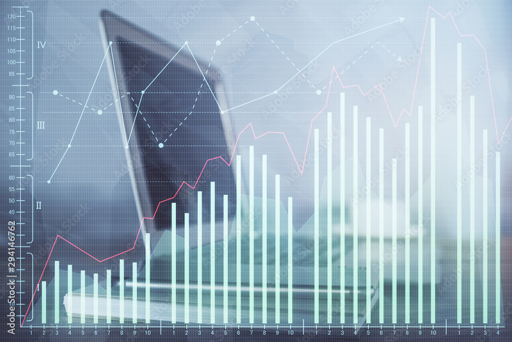 Financial chart drawing and table with computer on background. Multi exposure. Concept of international markets. Financial chart drawing and table with computer on background. Multi exposure. Concept of international markets.
