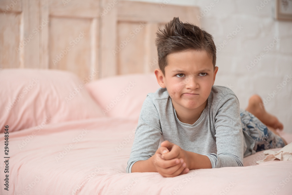 Funny brunette boy cute in his bed Funny brunette boy cute in his bed