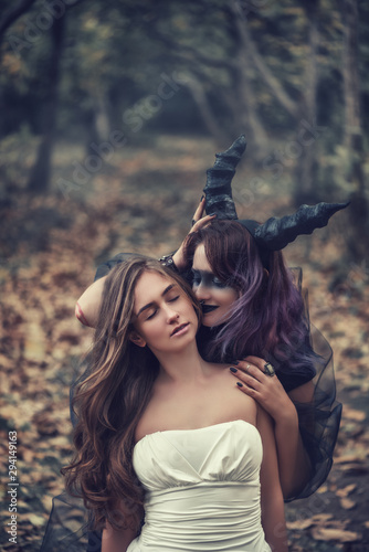 Fotografie emoness going to sacrifice the bride in magic autumn forest