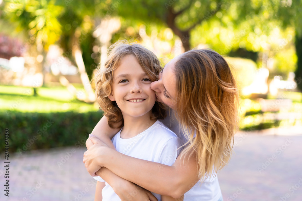 Fototapeta premium Happy mother and son in a park