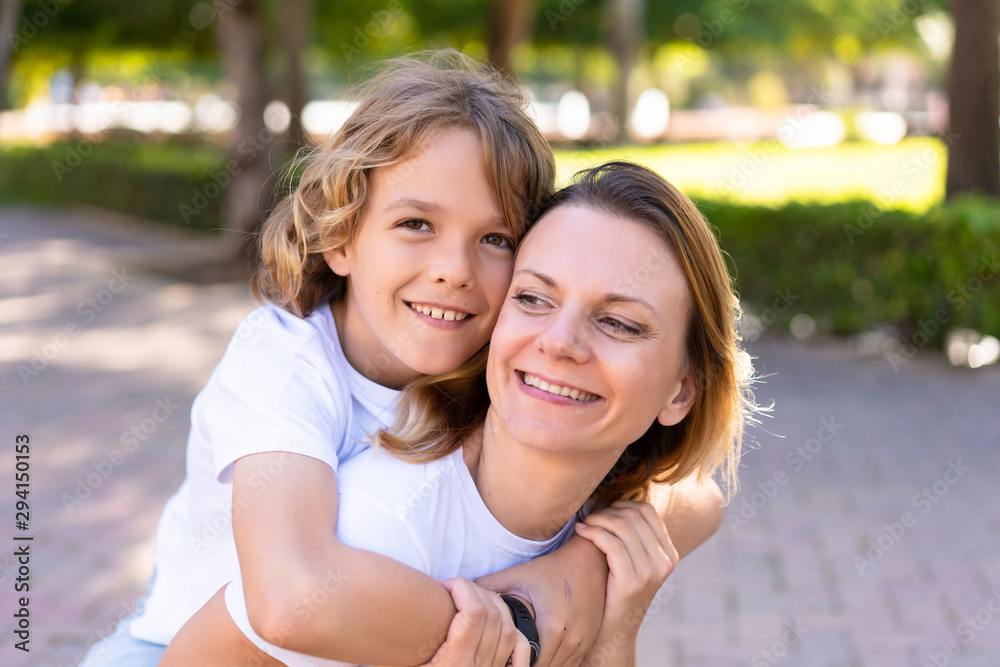 Happy mother and son in a park