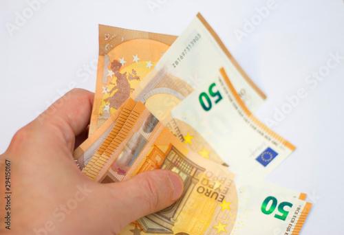 Fifty euro banknotes spread out isolated on white