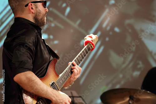 young man playing a guitar