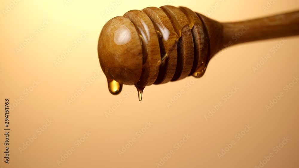 Close-up of Honey dripping from honey dipper in slow motion, 4k Close-up of Honey dripping from honey dipper in slow motion, 4k