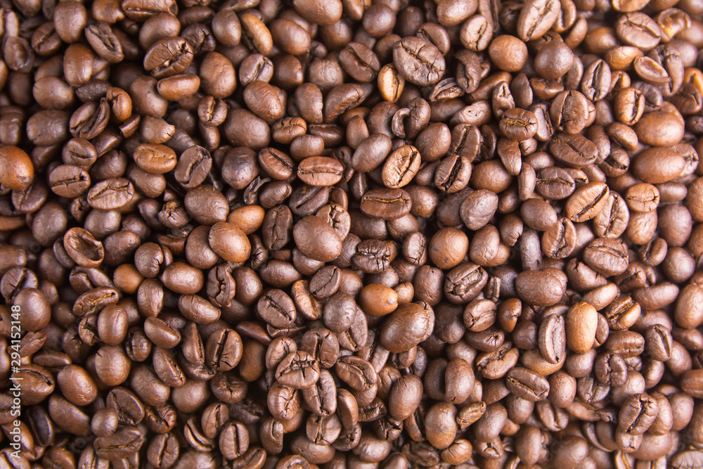 Fototapeta premium Roasted Coffee Beans background, Brown coffee beans for can be used as a background.