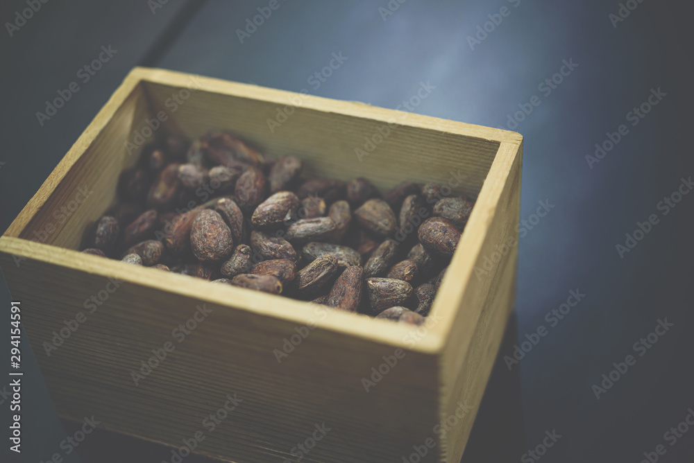 Cocoa Bean in wooden box in a cafe Cocoa Bean in wooden box in a cafe