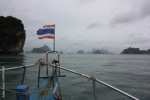 flag in front of the sea and islands. Thailand.