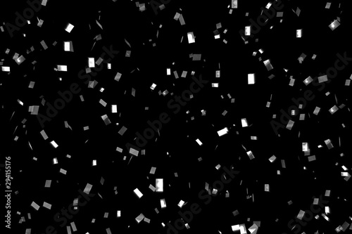 falling silver metallic glitter foil confetti, animation movement on black background, holiday and festive fun concept
