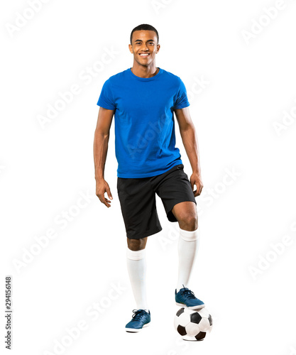 Full-length shot of African American football player man over isolated white background © luismolinero