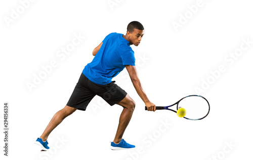 Full-length shot of African American tennis player man over isolated white background © luismolinero