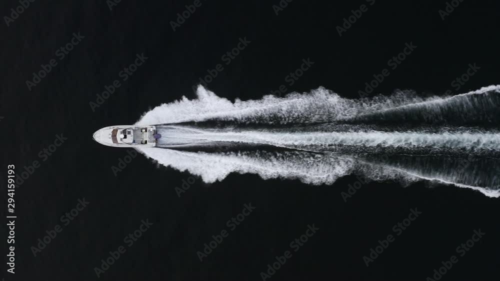 Aerial top view of motorboat sailing fast along Eastern Bosphorus strait. Vladivostok, Russia