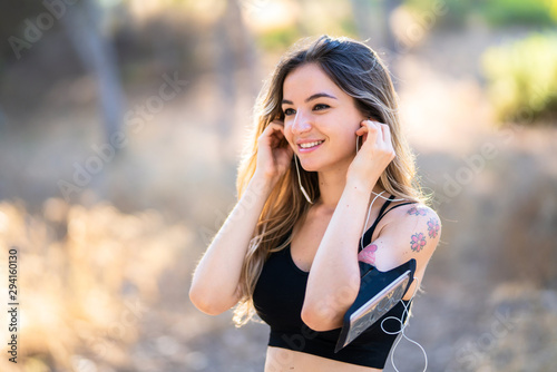 Young sport woman in a park at outdoors