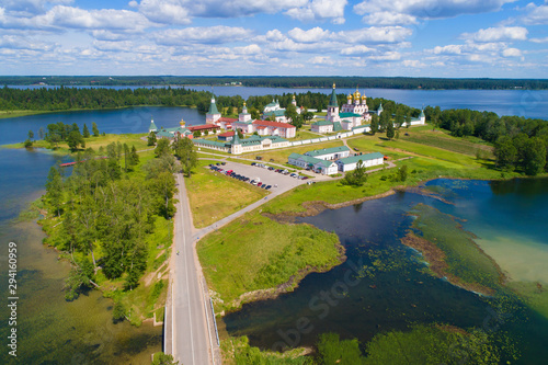 The old Valdayskiy Iverskiy Bogoroditskiy Svyatoozerskiy Monastery on a warm June afternoon (aerial photography). Novgorod region, Russia photo