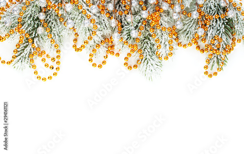 Xmas composition border. Winter fir branches and gold garland isolated on white background