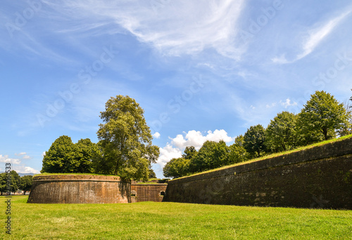 Scenic view of the exterior of the town walls of Lucca (16-17th centuries), longer than 4 kilometers and perfectly preserved, in a sunny summer day, Lucca, Tuscany, Italy photo