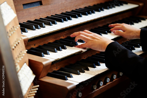 A woman playing the pipe organ  photo