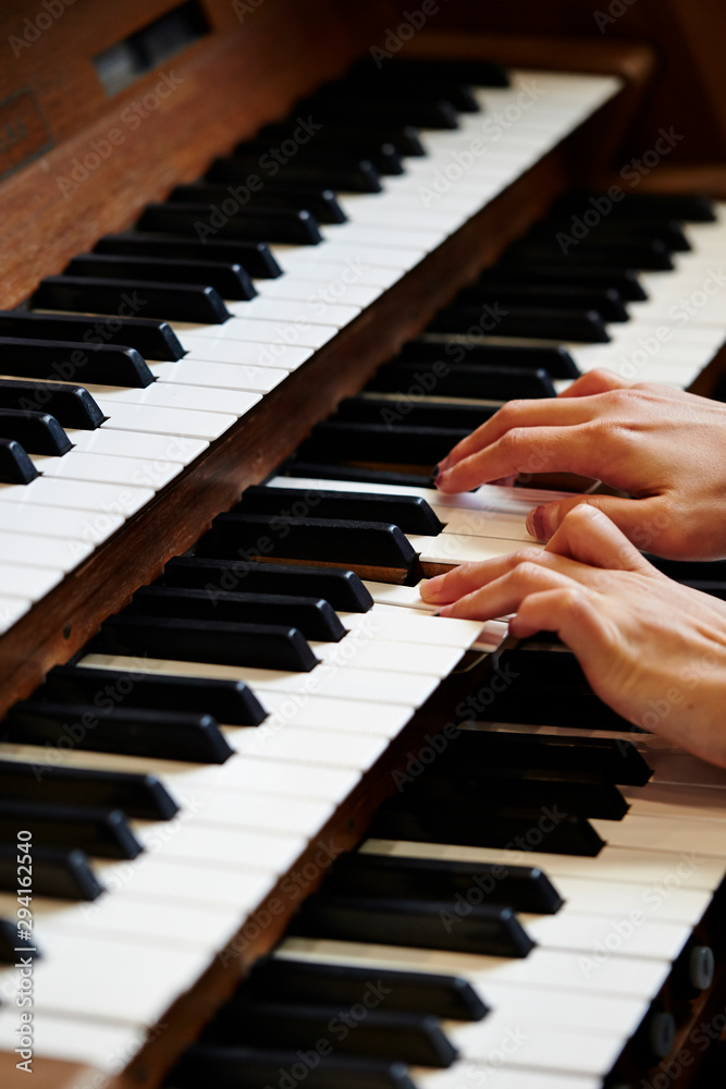 Fototapeta premium A woman playing the pipe organ