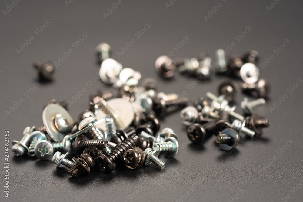 Screws and bolts fasteners industrial black background Screws and bolts fasteners industrial black background