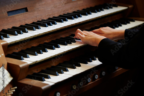 A woman playing the pipe organ  photo