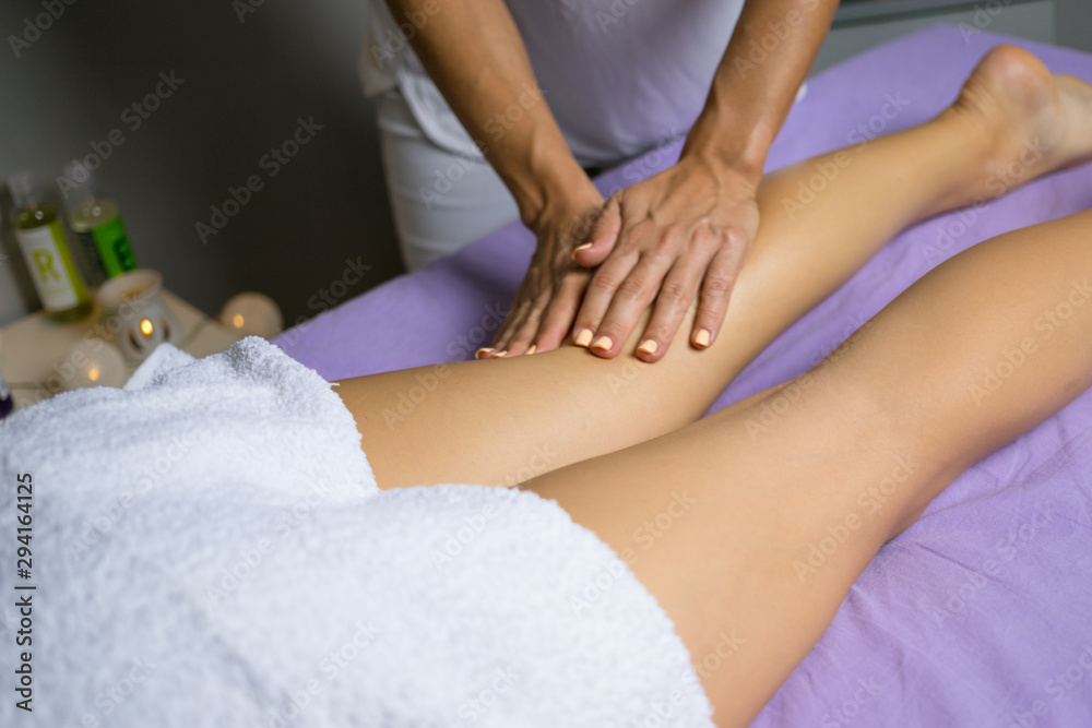 Female relaxing leg massage with hands. Beauty body skin care treatment concept. Female relaxing leg massage with hands. Beauty body skin care treatment concept.