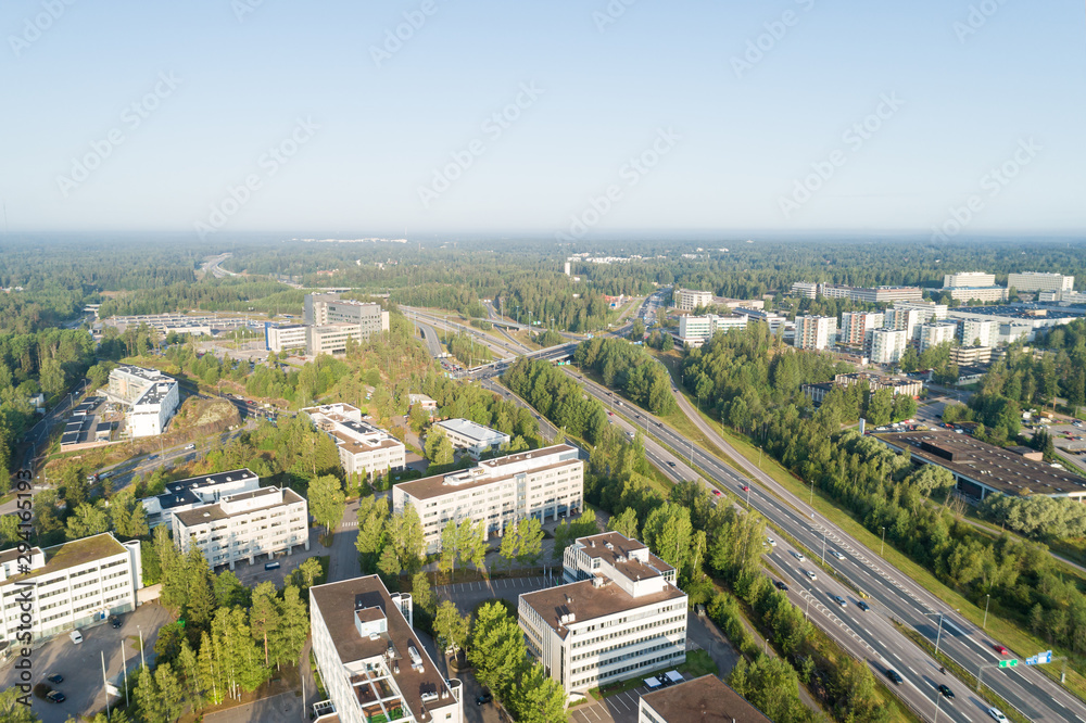  Aerial Drone Flight Photo of highway with cars and trucks. Road Junction in the big city. Top view. Cityscape in sunset soft light. Finland, Espoo, Europe