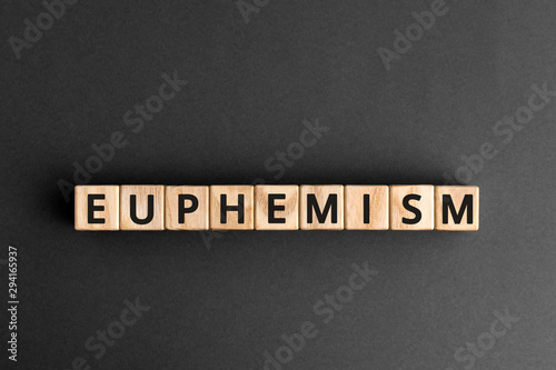 Euphemism - word from wooden blocks with letters, neutral word used to replace other indecent or inappropriate words euphemism concept, gray background